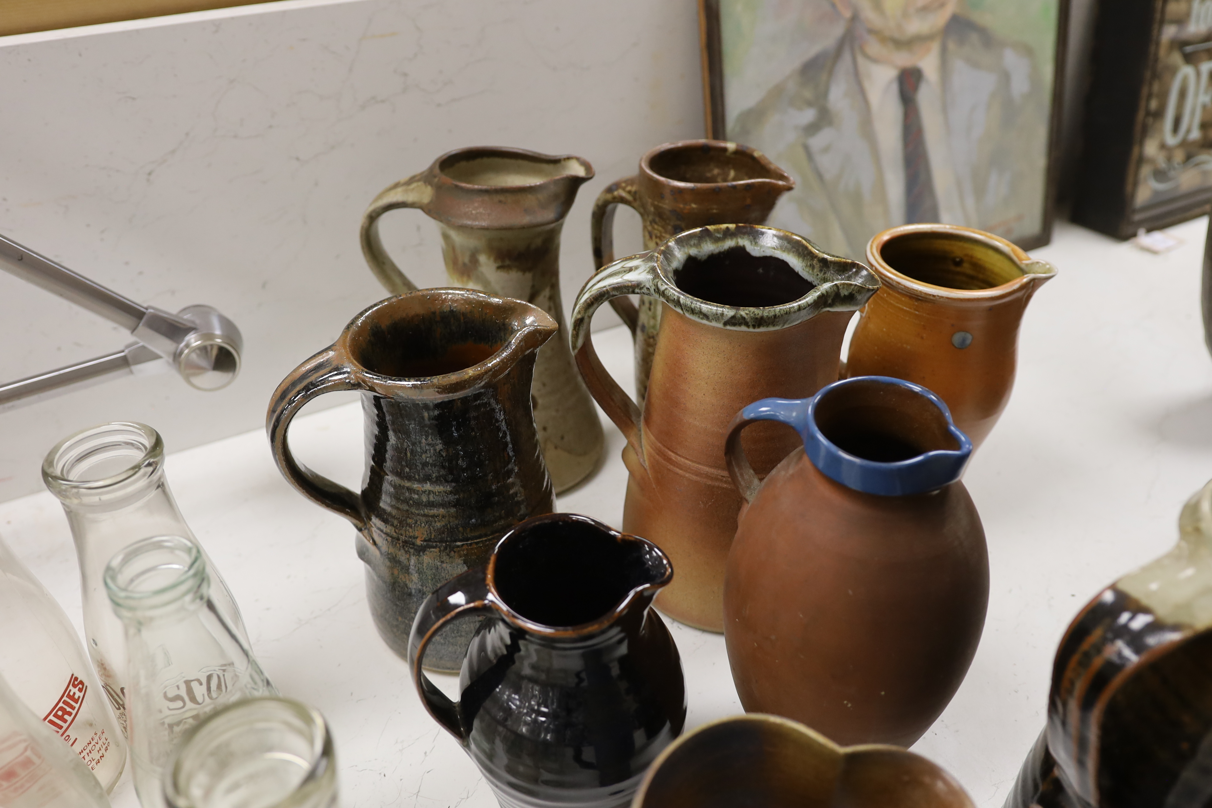 Eleven studio stoneware jugs / pitchers, including Muchelney tallest 26cm